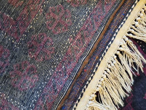 up close antique persian rug puple mauve tribal colors handmade